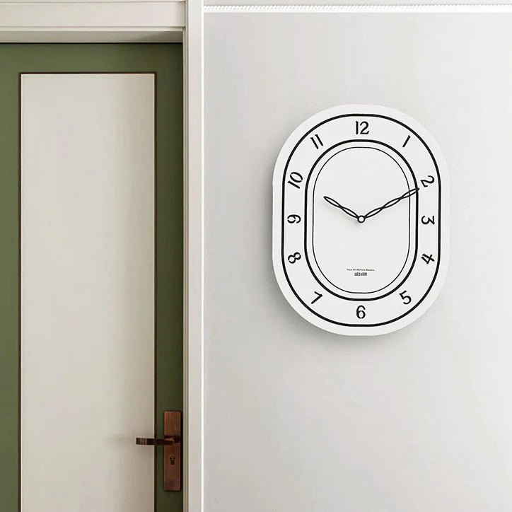Black & White Silent Oval Wall Clock – Laser Engraved Roman Design - Lattea Global