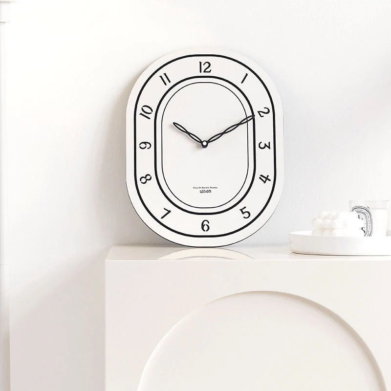 Black & White Silent Oval Wall Clock – Laser Engraved Roman Design - Lattea Global