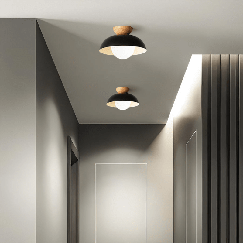 Lattea Global black metal dome flush ceiling light with wood accent and frosted glass diffuser.
