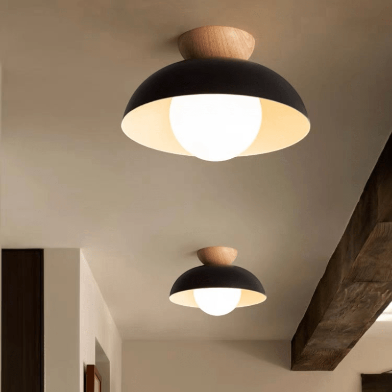 Lattea Global black metal dome flush ceiling light with frosted glass and wood cap, 30cm wide.
