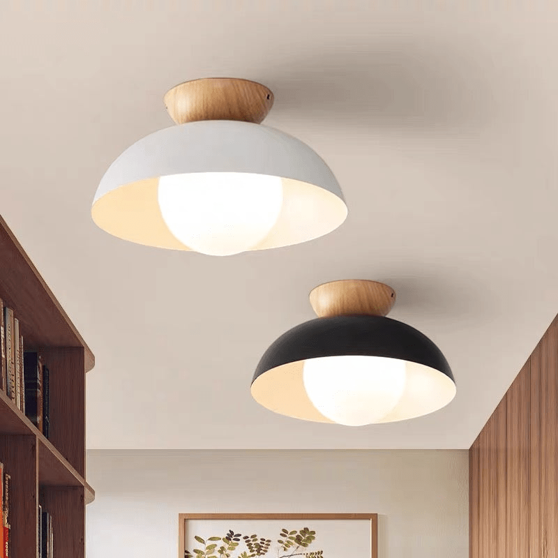 Lattea Global Nordic dome flush ceiling light in white or black metal with frosted glass and wood cap.