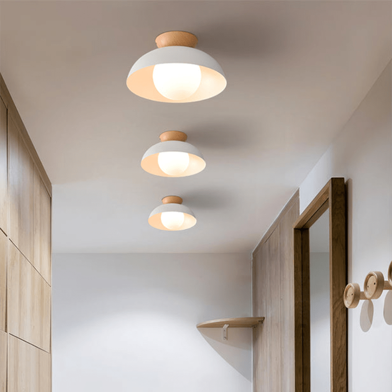 Lattea Global white dome flush ceiling light with wood cap and frosted glass diffuser.