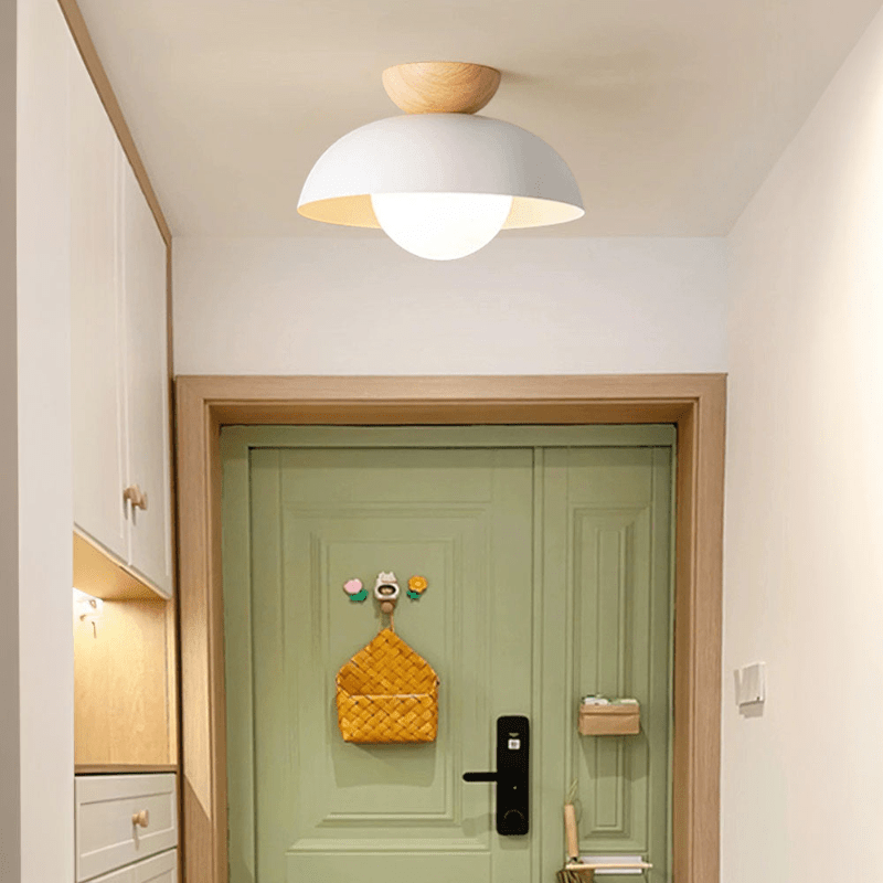 Lattea Global white metal dome flush ceiling light with frosted glass and natural wood cap.