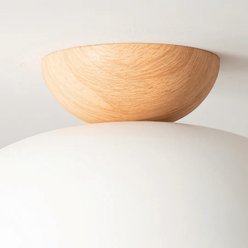 Lattea Global white dome flush ceiling light with natural wood cap, frosted glass diffuser.