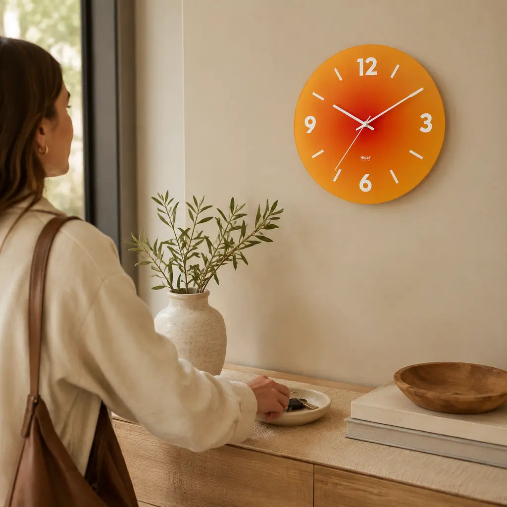 SunAura Sunset-Inspired Glass Wall Clock with numerals in an entryway