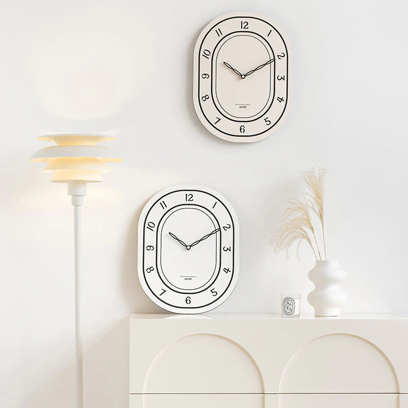 Black & White Silent Oval Wall Clock – Laser Engraved Roman Design