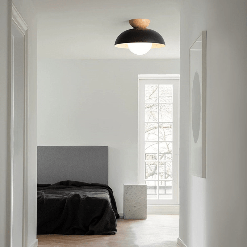 Lattea Global black metal dome flush ceiling light with wood cap and frosted glass diffuser.
