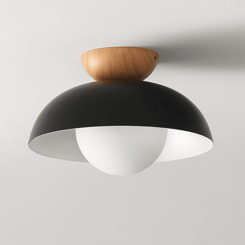 Lattea Global black metal dome flush ceiling light with frosted glass diffuser and natural wood cap.