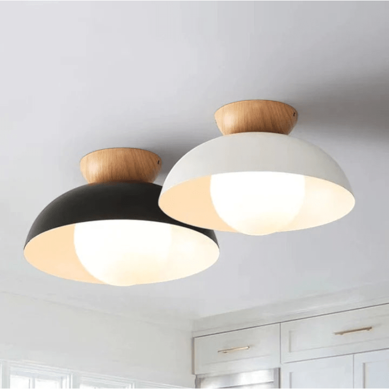 Lattea Global Nordic dome flush ceiling light with white or black metal shade, wood cap, and frosted glass diffuser.
