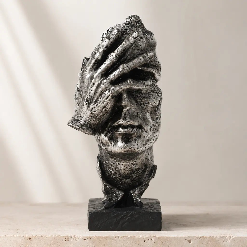 Odin's Faces Thinker sculpture in a silver finish hero display